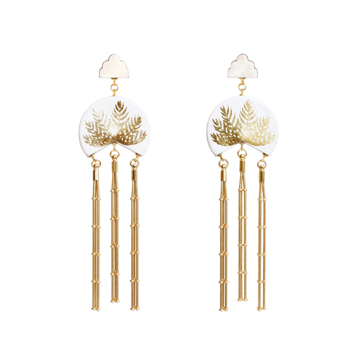 white leather medallion earrings, with gold palm tree print, gold tassels & mother of pearl cloud shade studs.