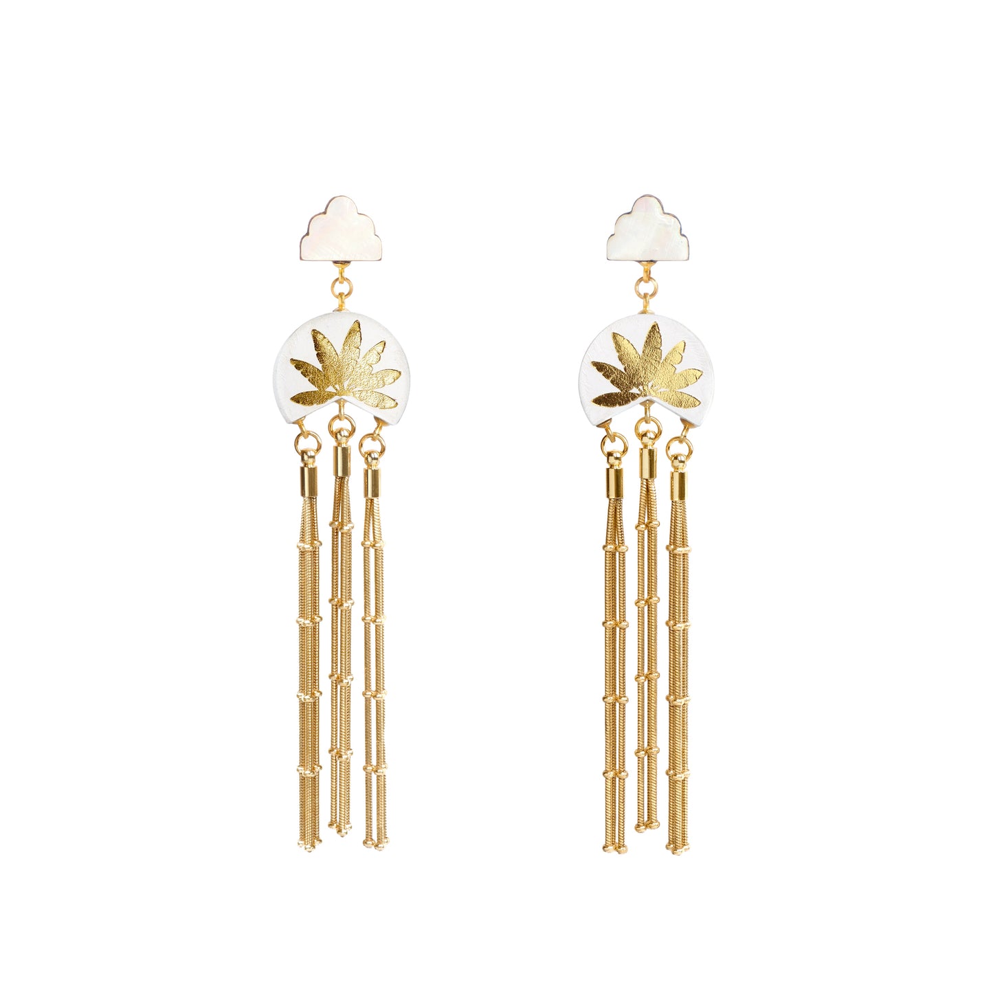 white leather medallion earrings, with gold palm tree print, gold tassels & mother of pearl cloud shade studs.