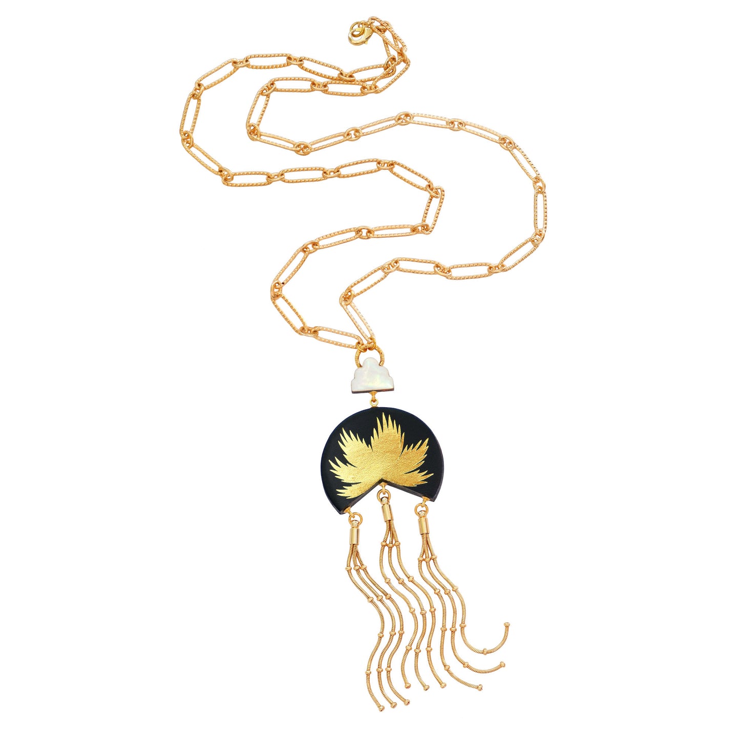 leather medallion pendant, with gold palm tree print, long gold chain tassels, and mother of pearl cloud, on long-link gold chain