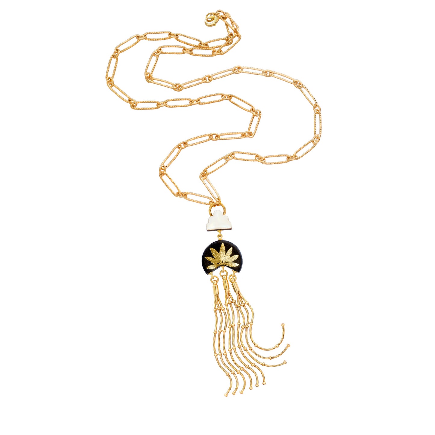 leather medallion pendant, with gold palm tree print, long gold chain tassels, and mother of pearl cloud, on long-link gold chain