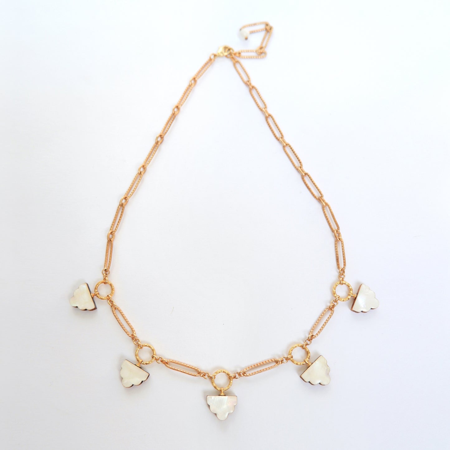 long-link gold chain charm necklace, with deco cloud charms in mother of pearl