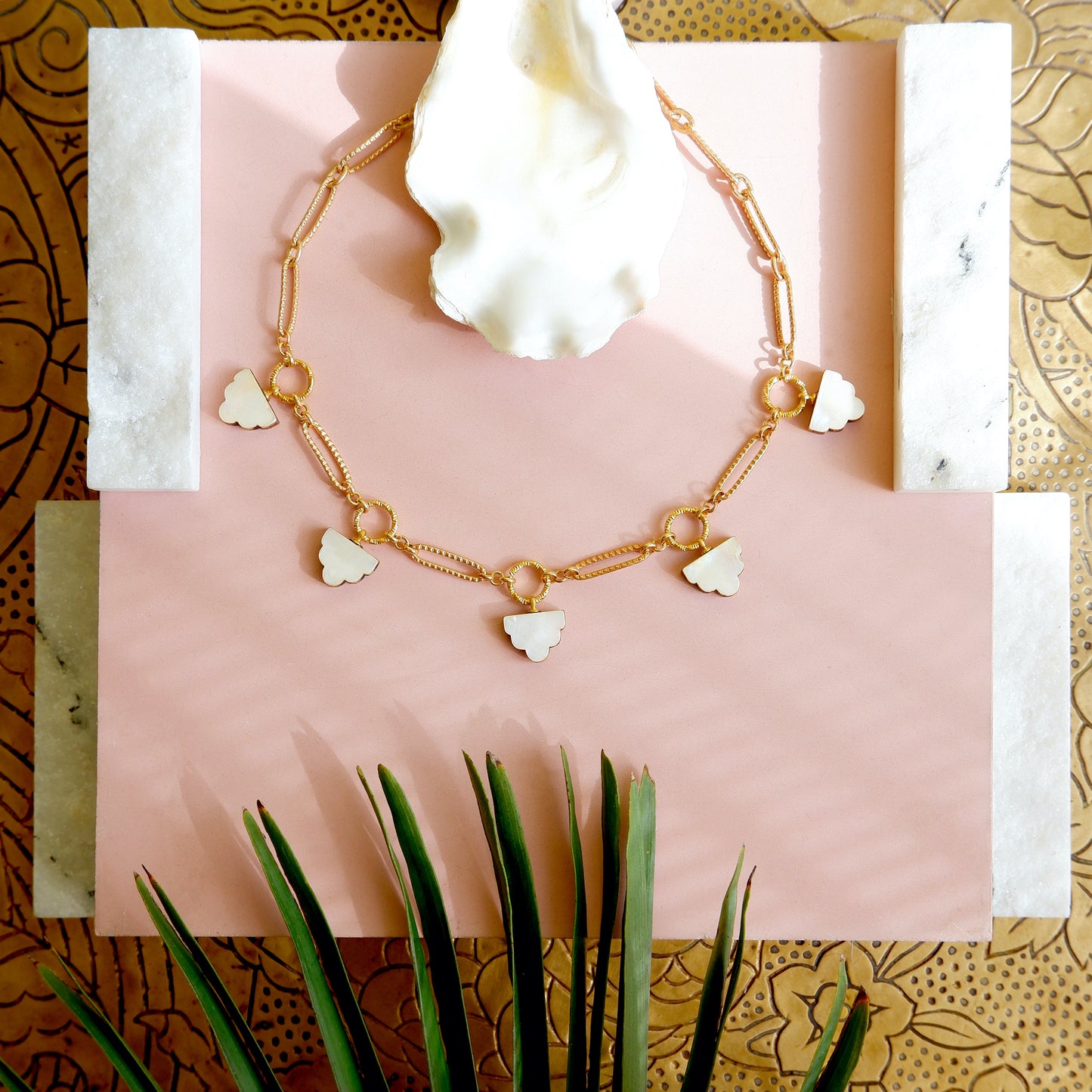 long-link gold chain charm necklace, with deco cloud charms in mother of pearl
