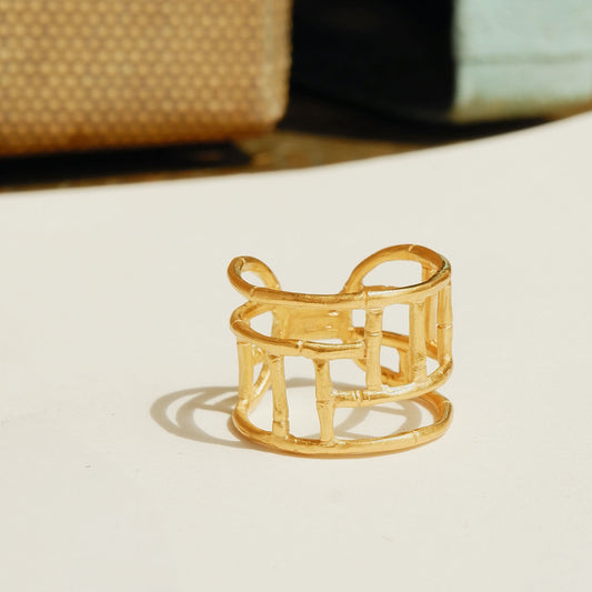 Wide Gold ring with geometric open-work Bamboo screen design, on a white background