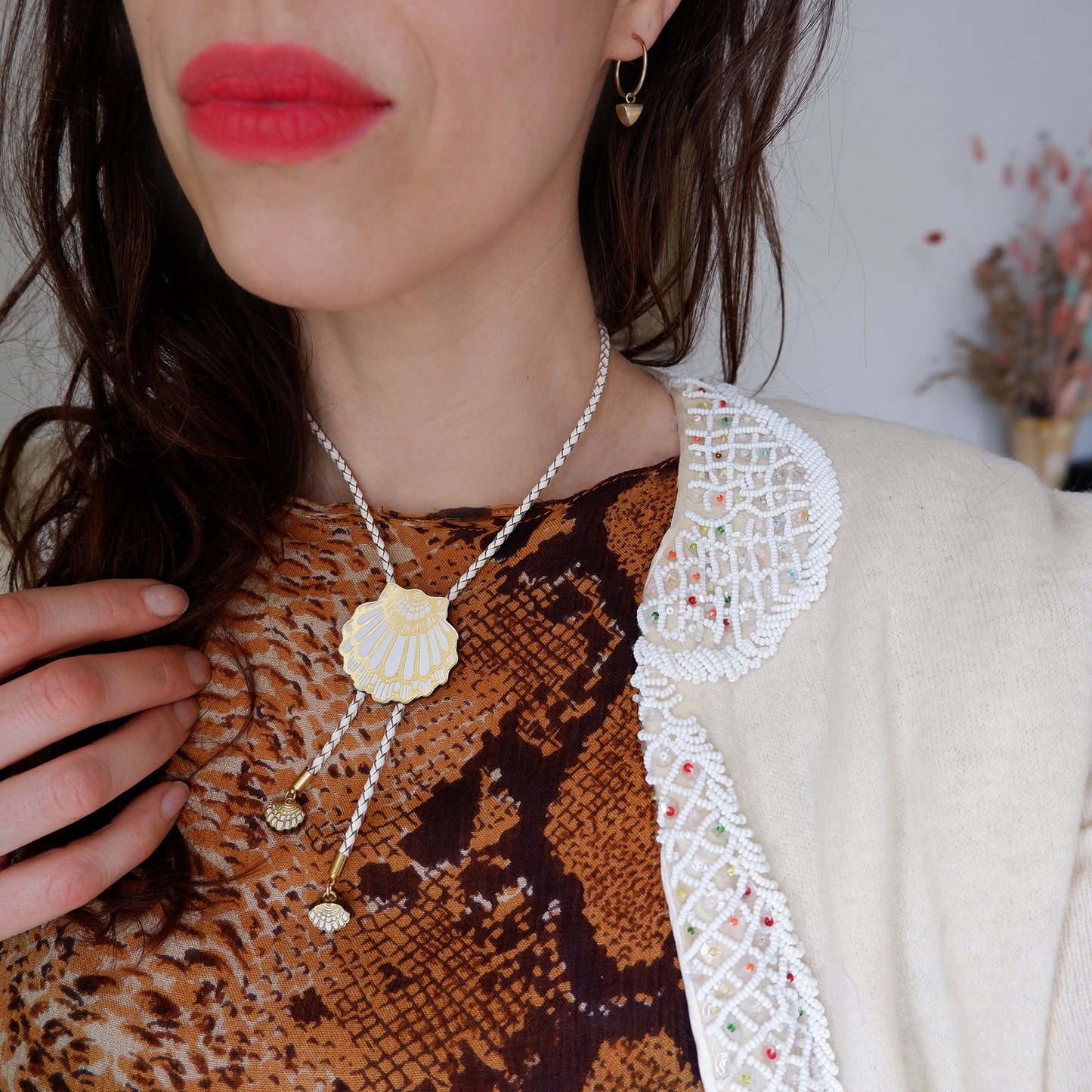 leather shell bolo necklace in white on model