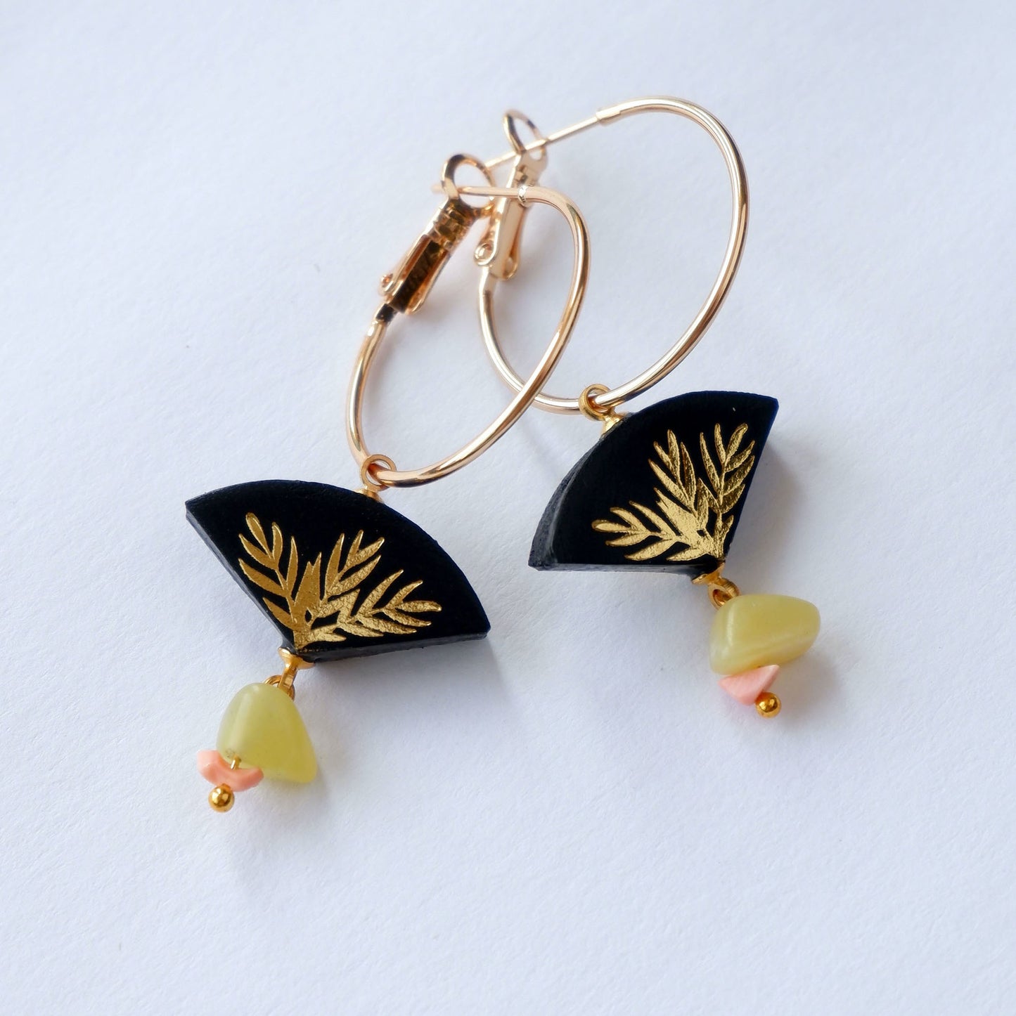 black & gold palm print leather gold hoop earrings with pink & yellow gemstone bead