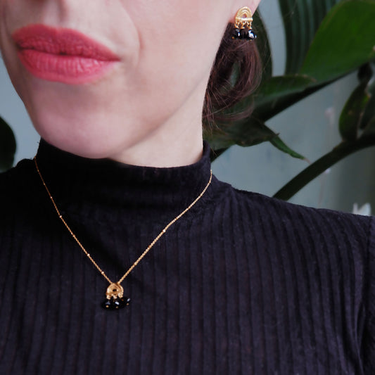 small stud earrings in Gold Vermeil, featuring a triple arch of bamboo, hung with Pyramid Trillion Beads in Black Onyx