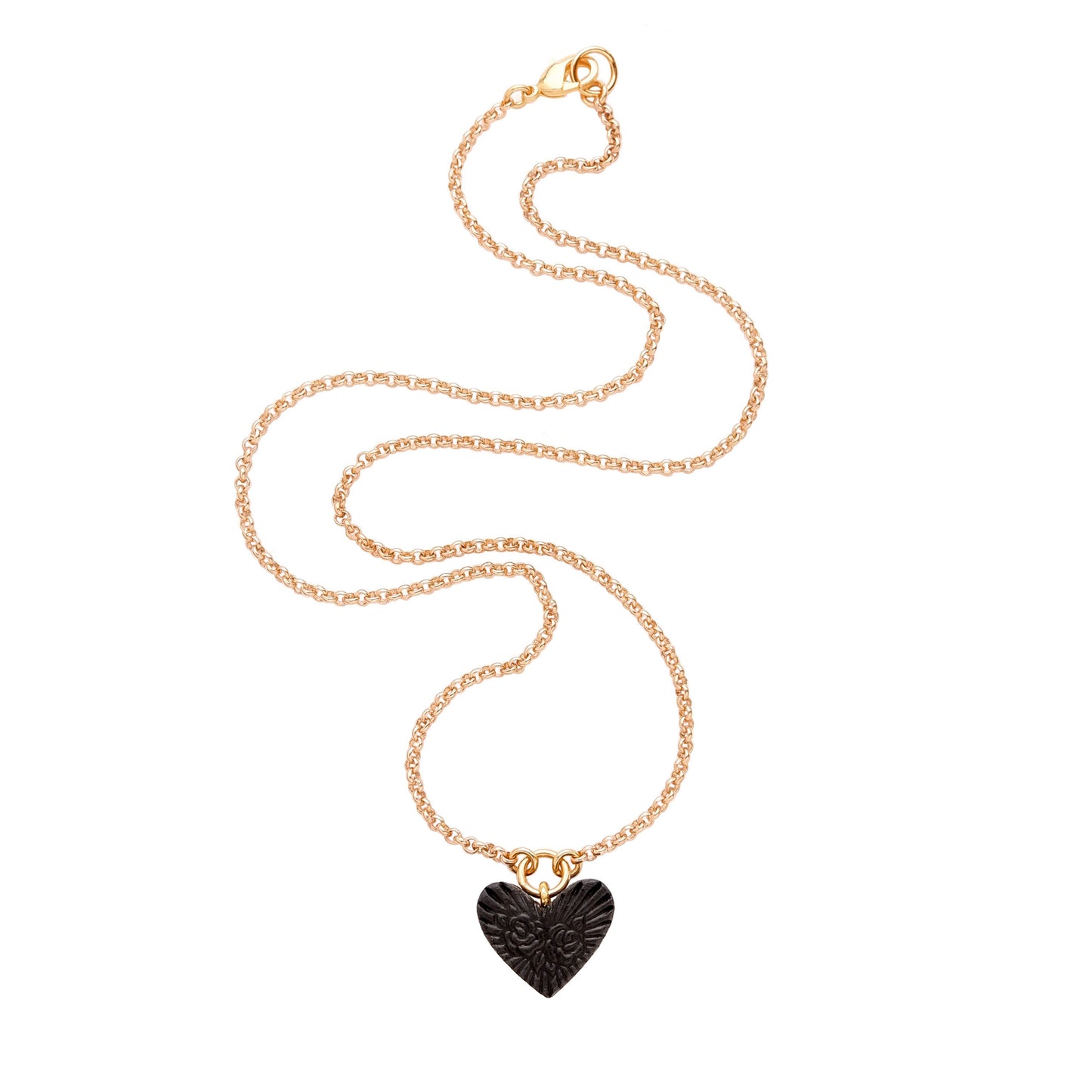 small Black Leather Heart pendant; embossed with a rose & rays design, on fine gold-plated belcher chain.