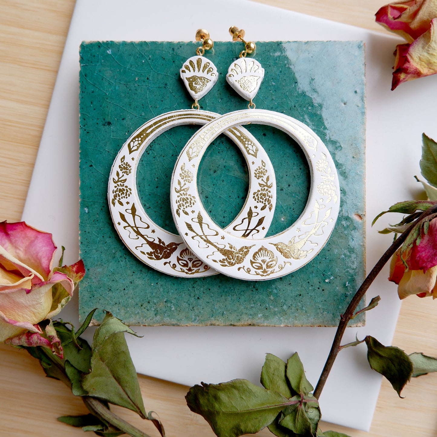 large hoops earring printed with birds & flowers in gold on white leather