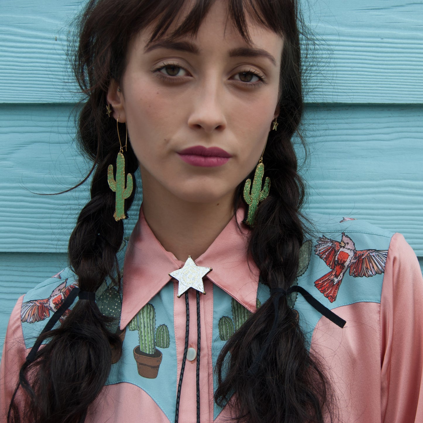 leather cactus cacti earrings, gold print, model, silk cowboy shirt