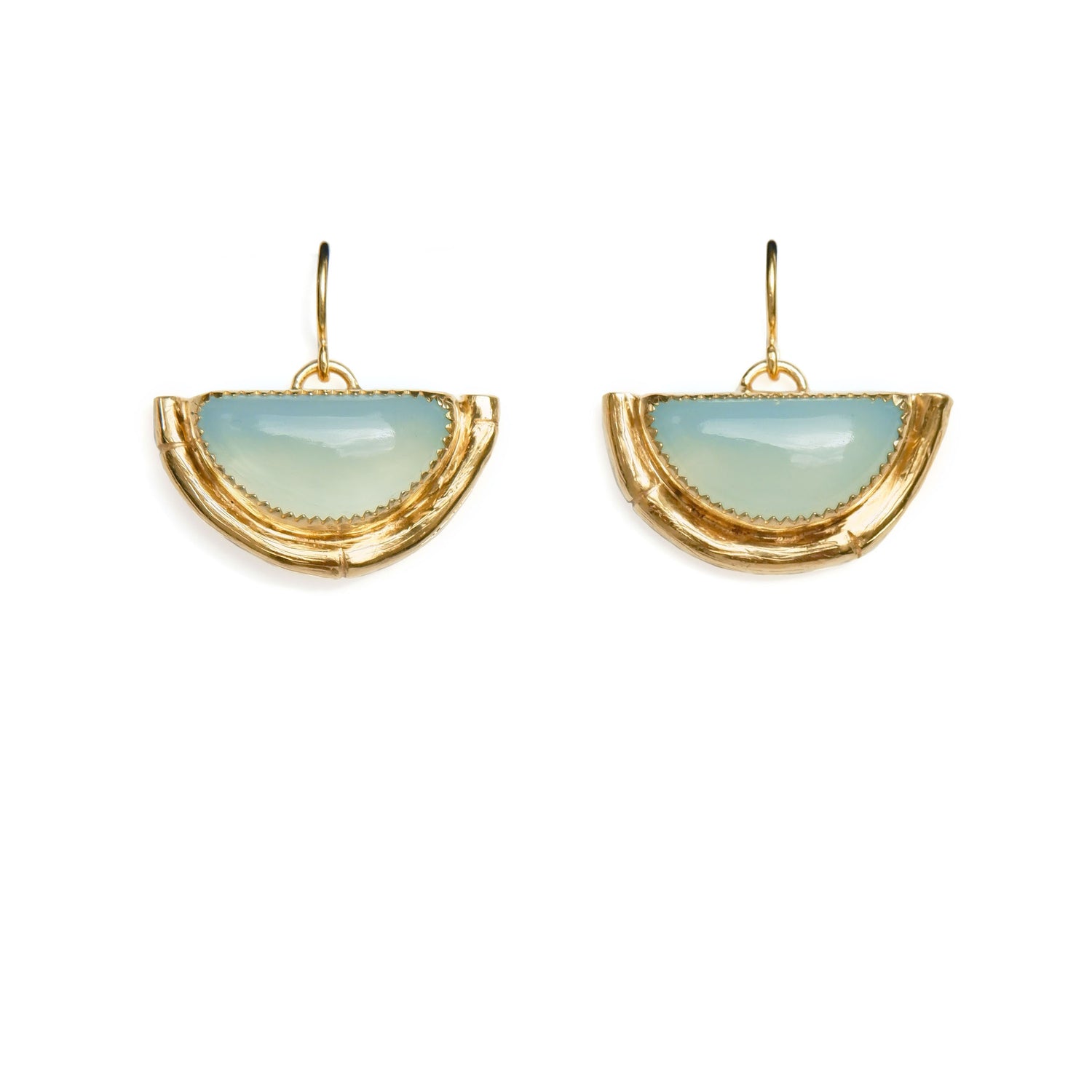 Earrings featuring half moon shaped semi precious aqua blue chalcedony gemstones,  cupped by solid silver bamboo hammock, plated in gold vermeil, with simple wire ear hooks.