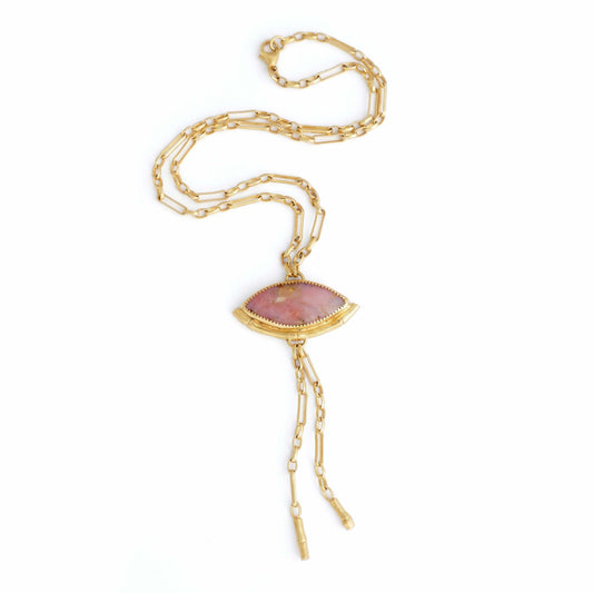 Gold Lariat style chain necklace, with a  wide Marquise shaped Pink Peruvian opal gemstone pendant, framed by a half halo of Gold bamboo. On white background.