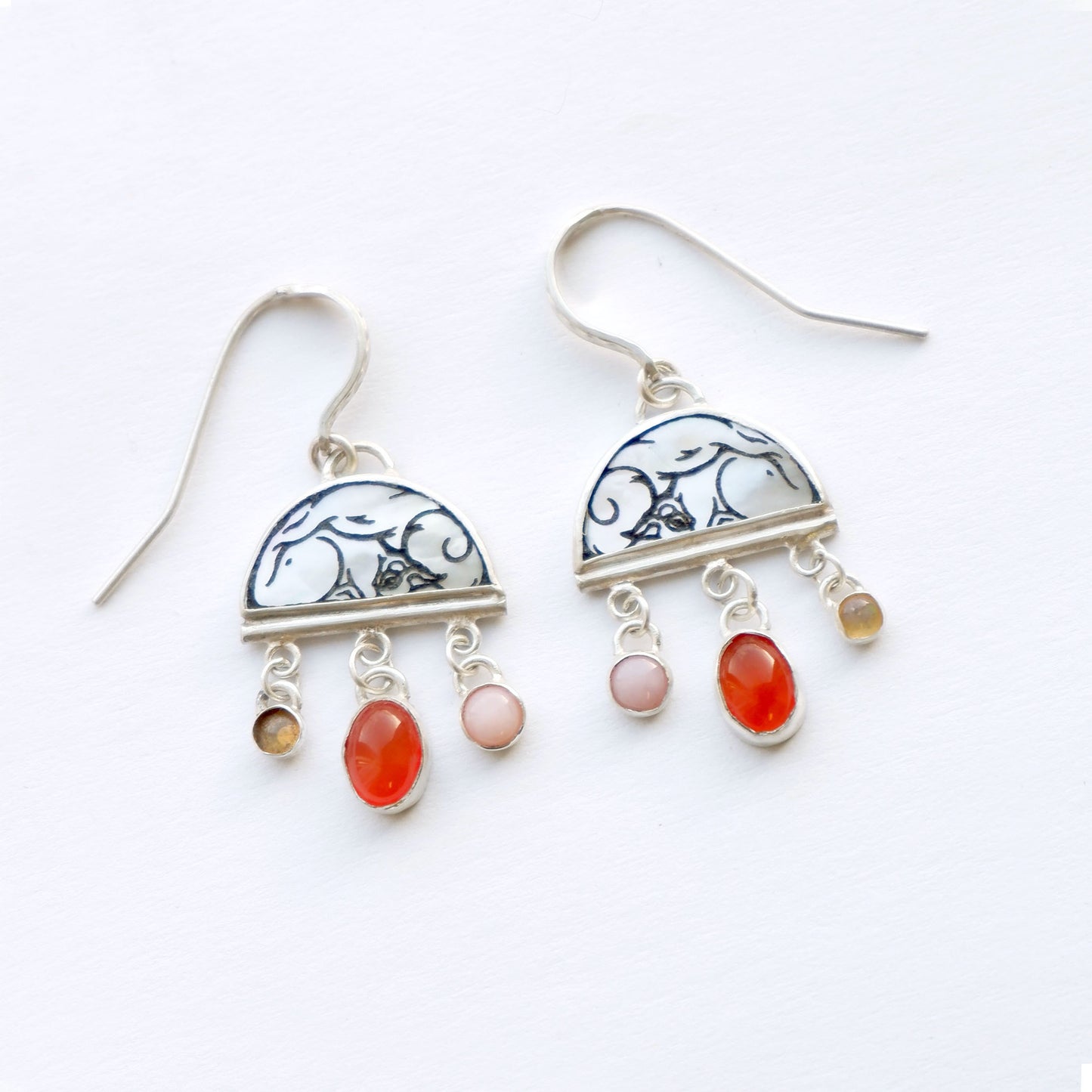 sterling silver half moon earrings, set with mother of pearl, engraved with squirrel illustration, and gemstone drops.