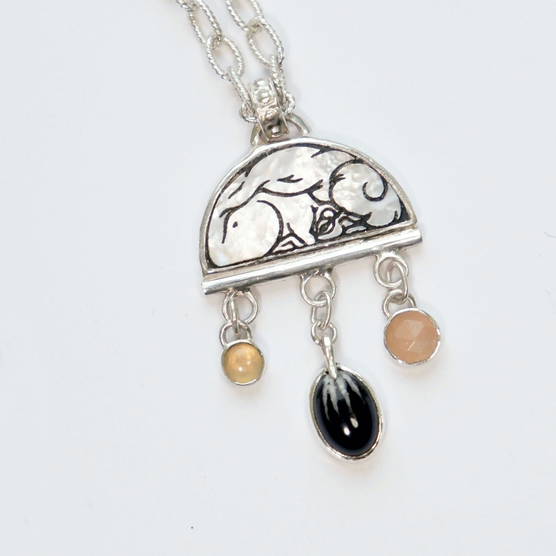 sterling silver half moon pendant, set with mother of pearl, engraved with squirrel illustration, and gemstone drops, on silver twisted oval link chain