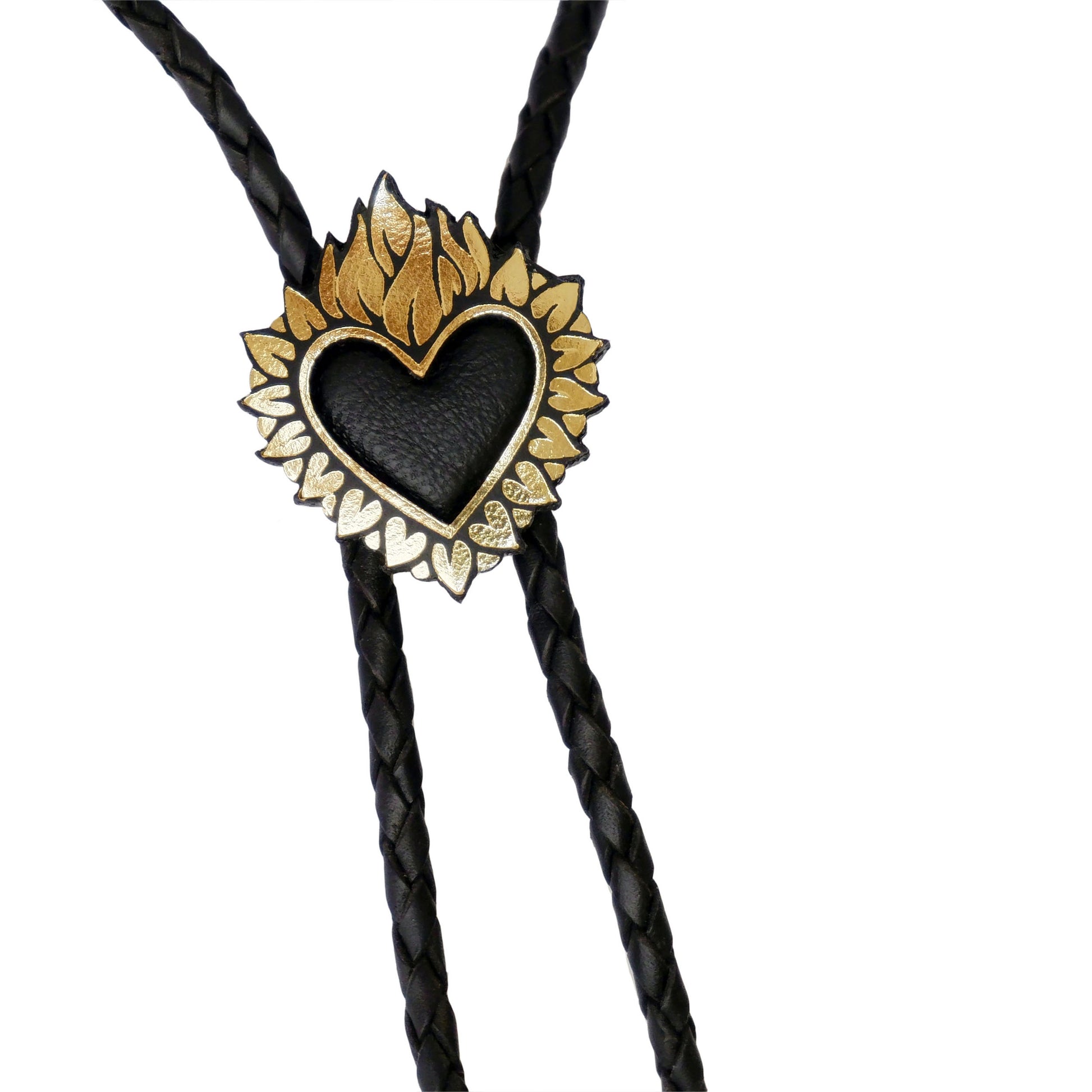 Flaming Heart Pendant, in Gold Foiled Leather, with a black padded leather centre, mounted on black braided leather bolo cord. Close-up crop