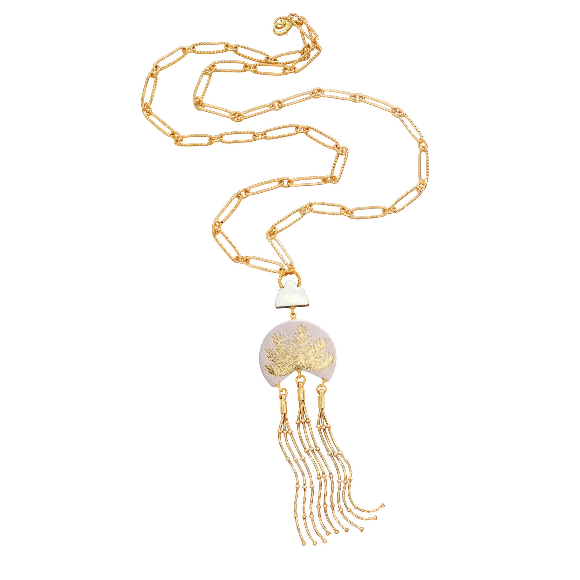 leather medallion pendant, with gold palm tree print,  long gold chain tassels, and mother of pearl cloud, on long-link gold chain