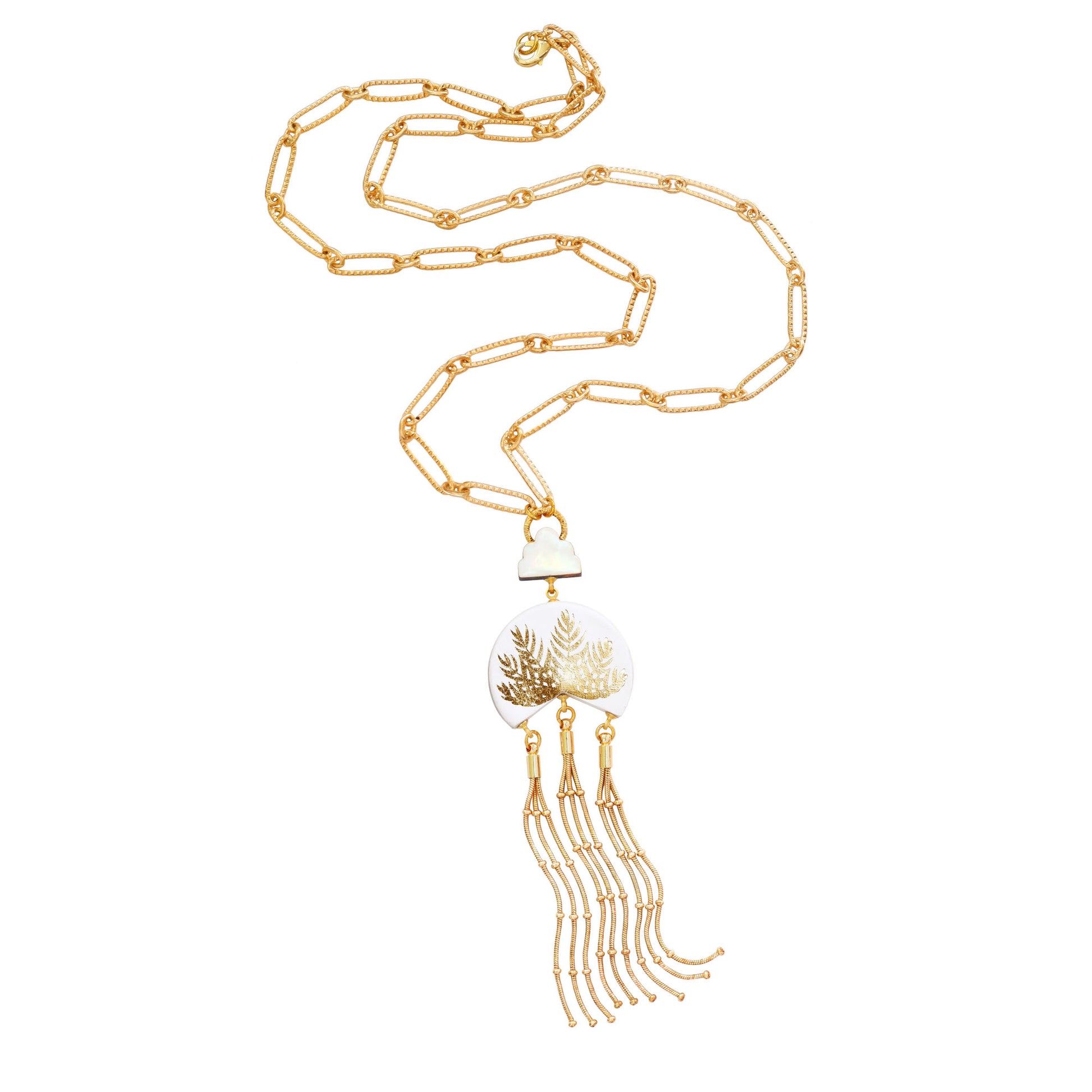 leather medallion pendant, with gold palm tree print,  long gold chain tassels, and mother of pearl cloud, on long-link gold chain