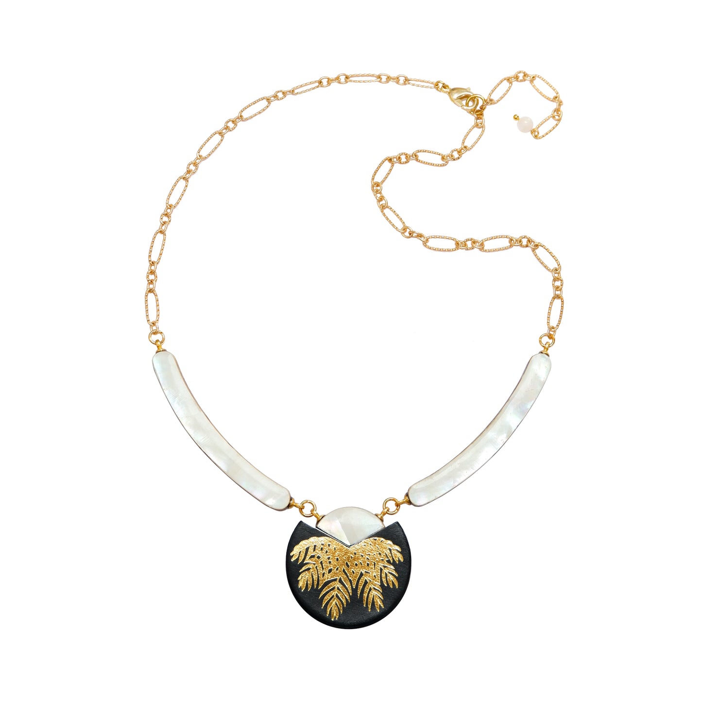 necklace with curved mother of pearl bars , black leather medallion with a gold palm print