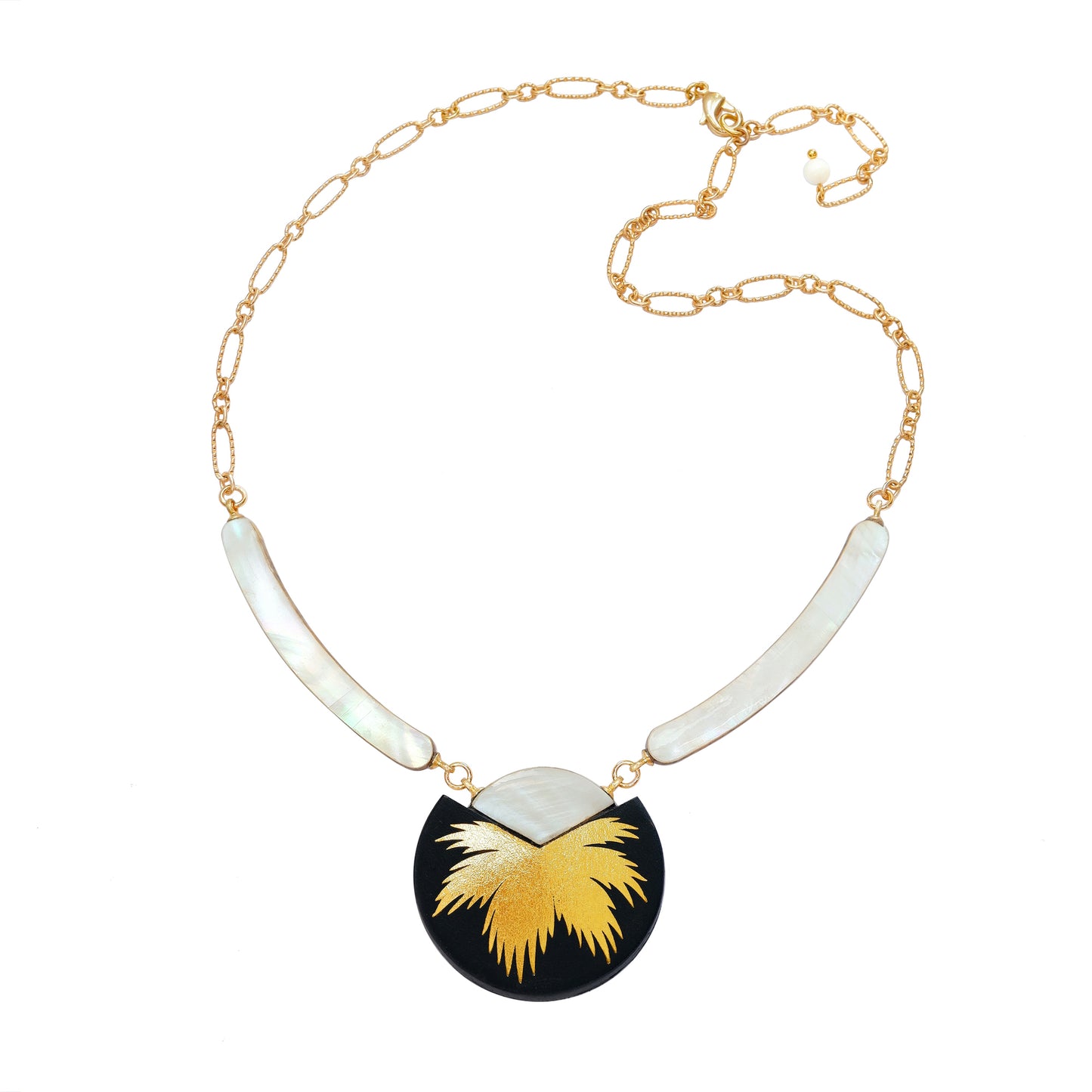 necklace with curved mother of pearl bars , black leather medallion with a gold palm print