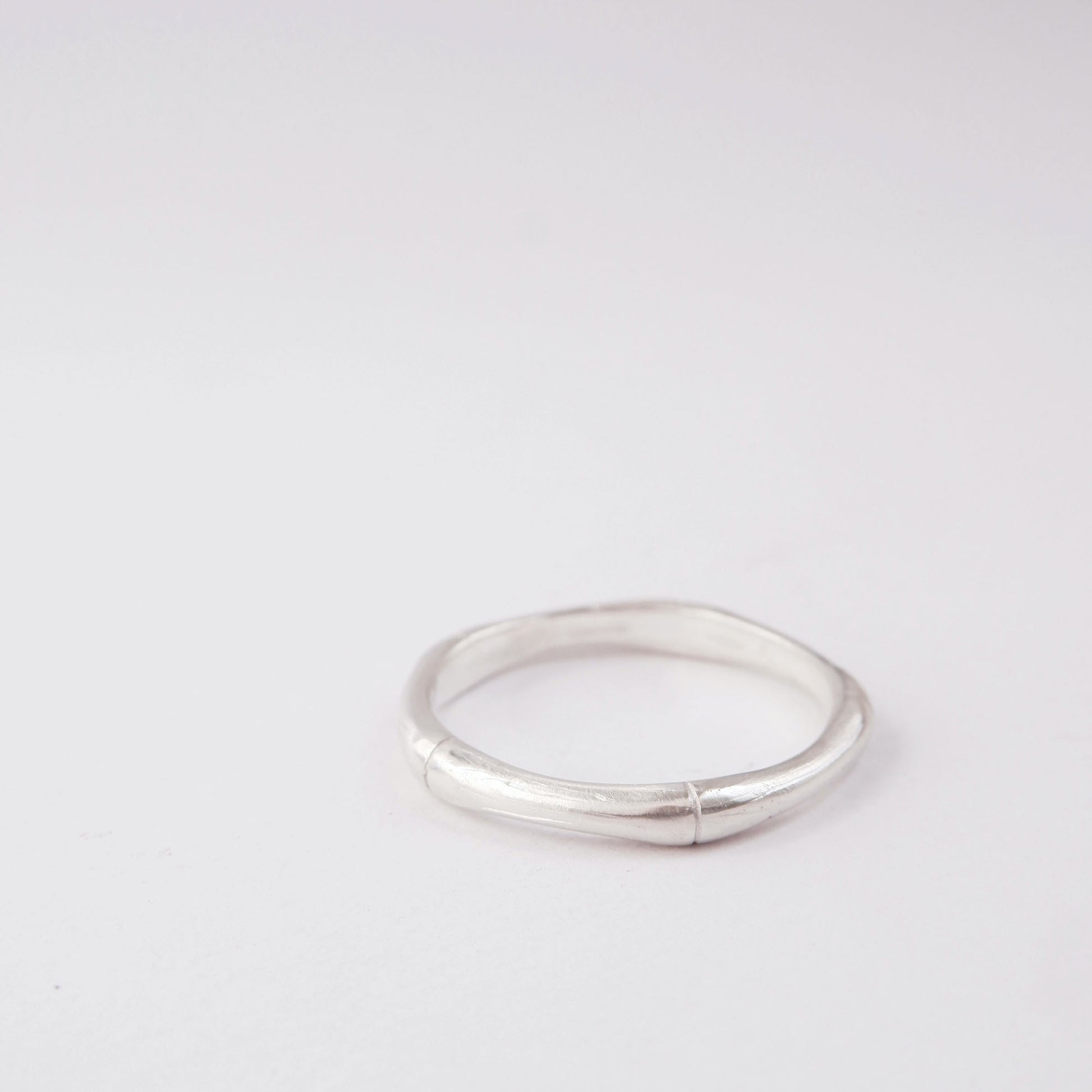 Sterling silver bamboo style stacking ring, on white background