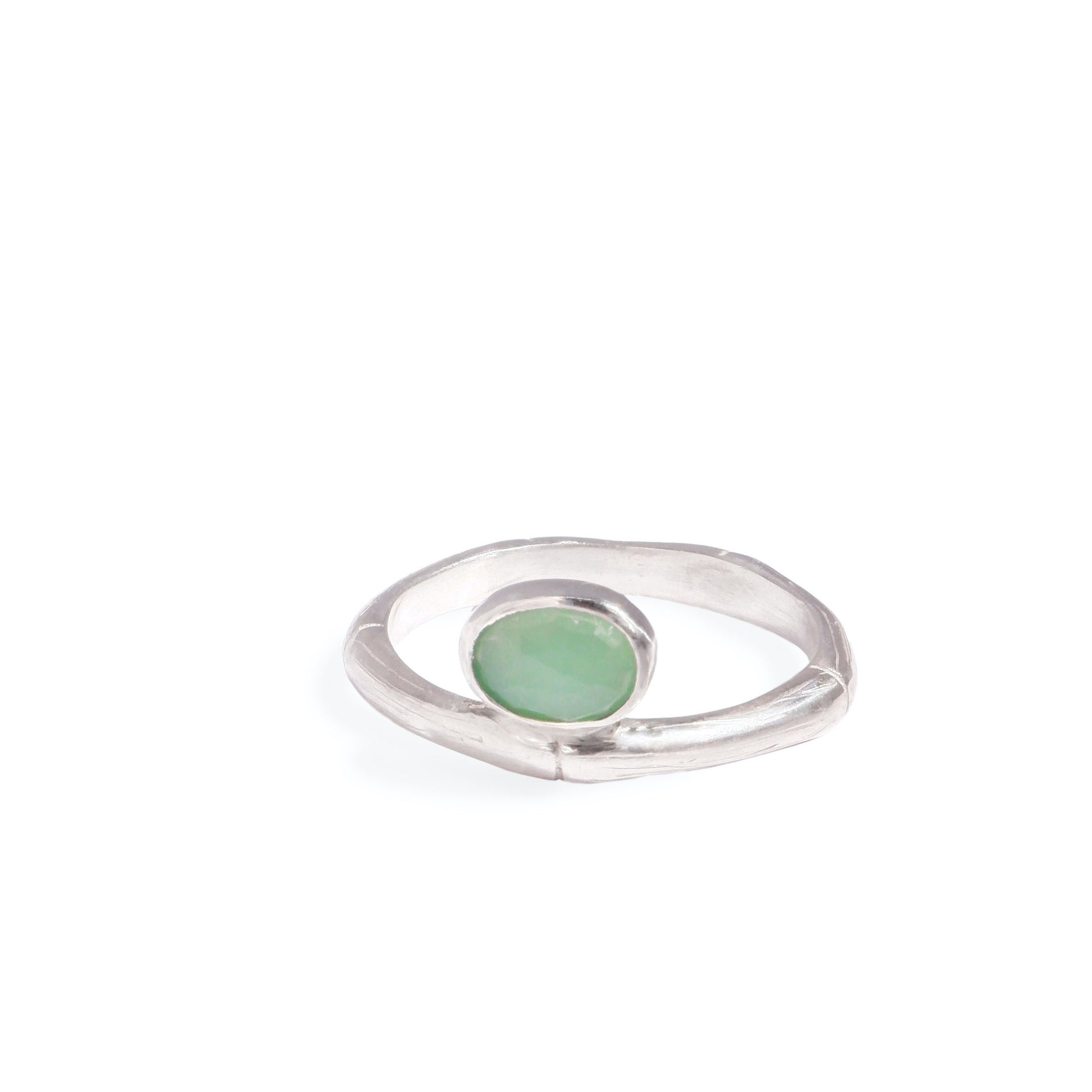 Sterling Silver bamboo style ring with a small oval pale apple green Chrysoprase gem stone, on a white background