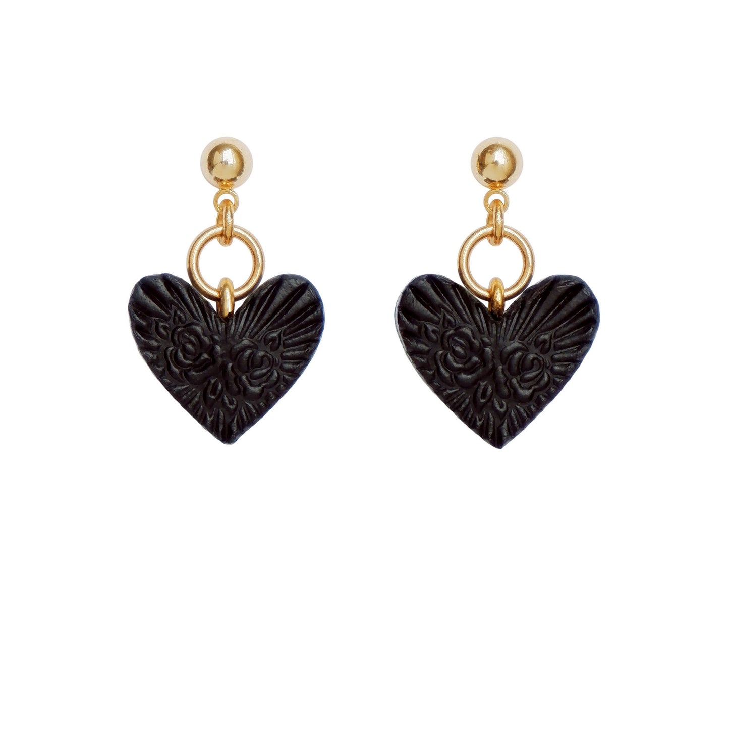 Gold ball stud earrings, with small black, embossed leather heart pendants.