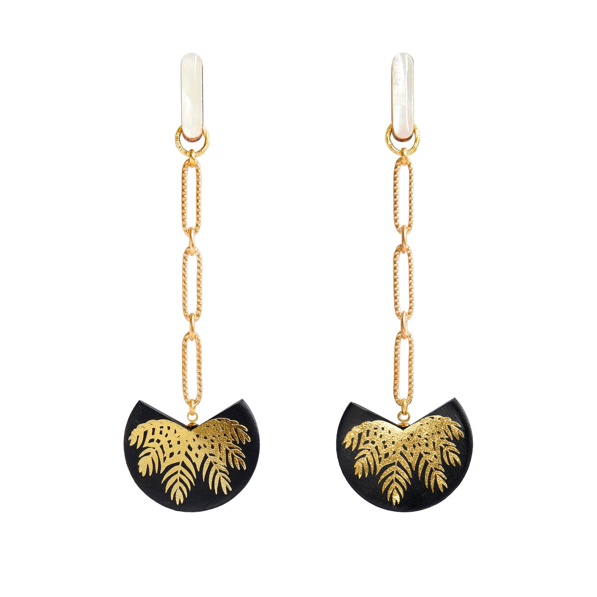 palm tree drop earrings. black leather medallions with gold palm print, on longl-link chain from long mother of pearl studs