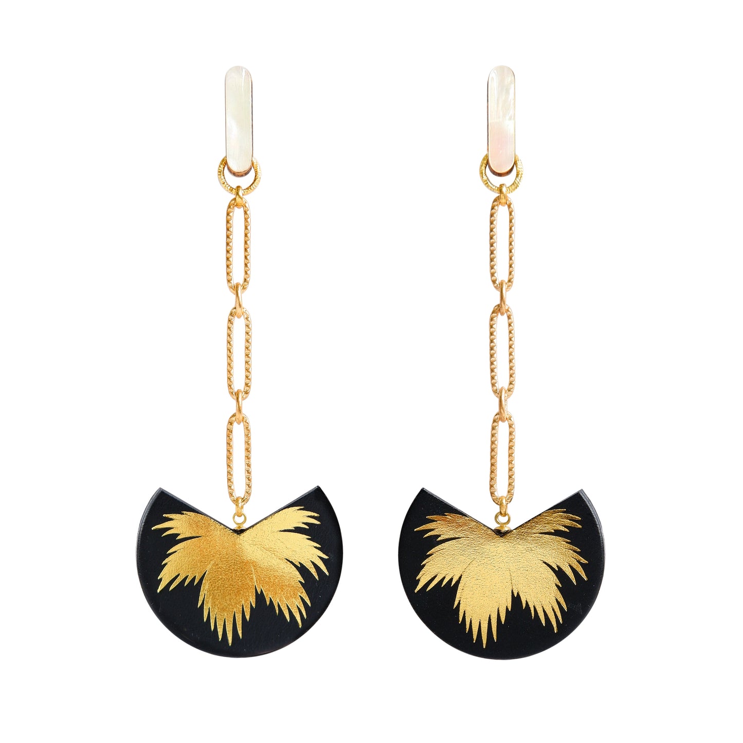 palm tree drop earrings. black leather medallions with gold palm print, on longl-link chain from long mother of pearl studs