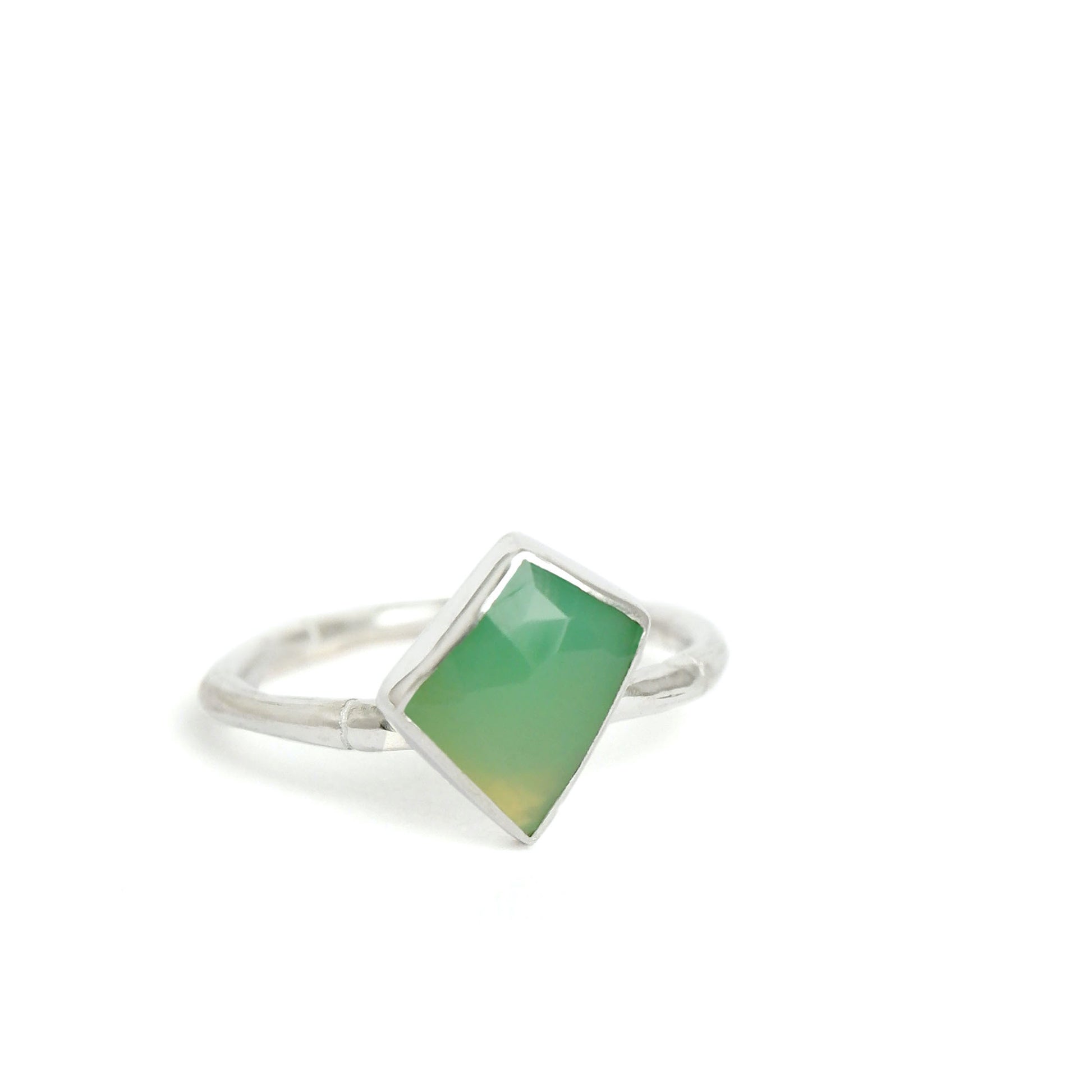 Sterling Silver bamboo style ring with a an irregular angular geometric Chrysoprase gem stone, on a white background