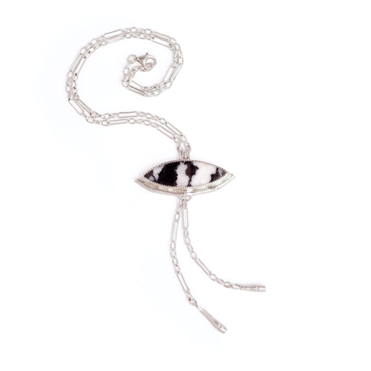 Silver Lariat style chain necklace, with a marquise cut black & white stripe Zebra Jasper gemstone pendant, framed  by a half halo of silver bamboo. 