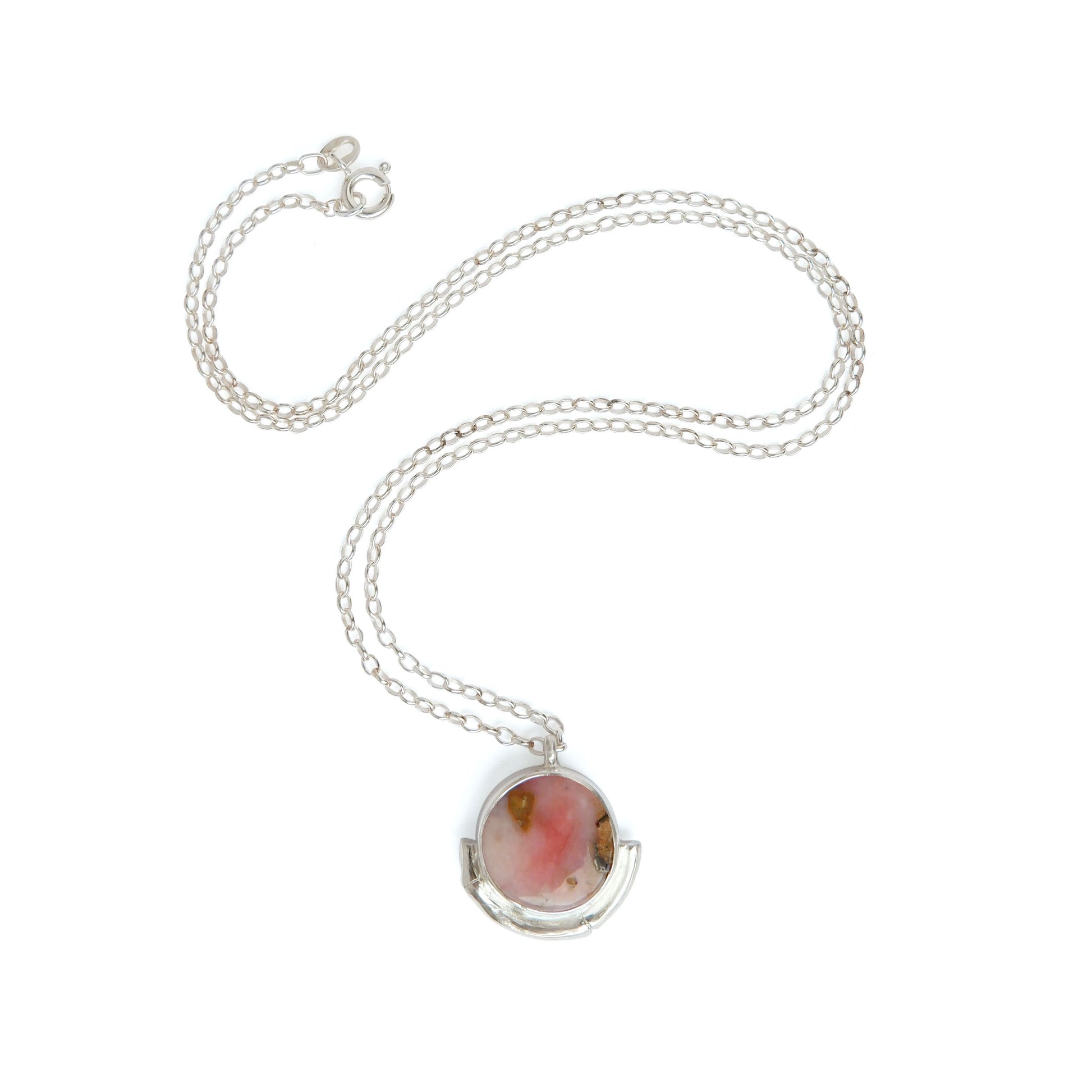 pink Opal gemstone circle pendant, framed by a silver bamboo style half moon halo mount, on a fine silver chain.