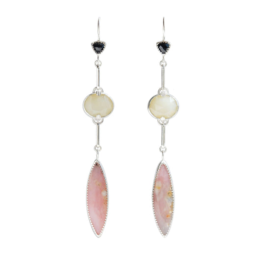 A pair of long drop earrings handcrafted in recycled Sterling Silver, featuring stunning Peruvian Pink Opal Marquise Cabochons, rare faceted butter-yellow Kenyan Opal ovals, and tiny faceted black Onyx Trillions. White background