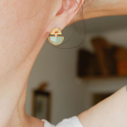 small stud earrings in sterling silverl, featuring triple arches of bamboo, hung with a half moon shaped Aventurine gemstone, set with silver teeth, on model
