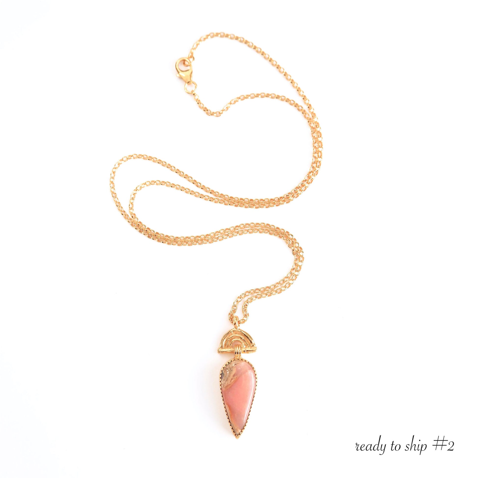 Pendant with long Pear-shaped Pink Opal Gemstone hanging from gold Bamboo Arch, on fine gold chain.