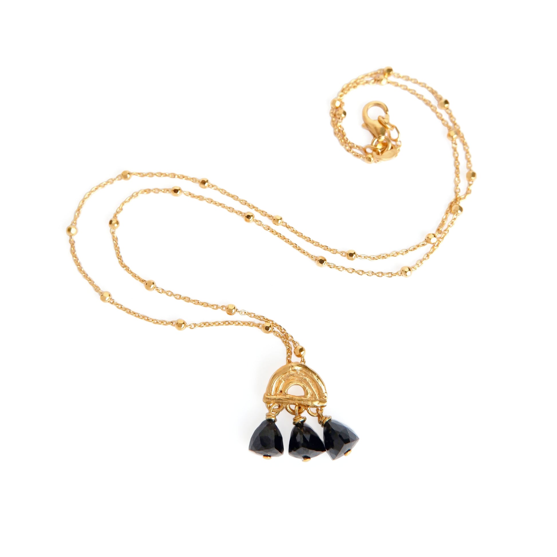 small pendant in Gold Vermeil, featuring a triple arch of bamboo, fringed with pyramid trillion beads in black onyx, on beaded satellite chain in sterling silver.