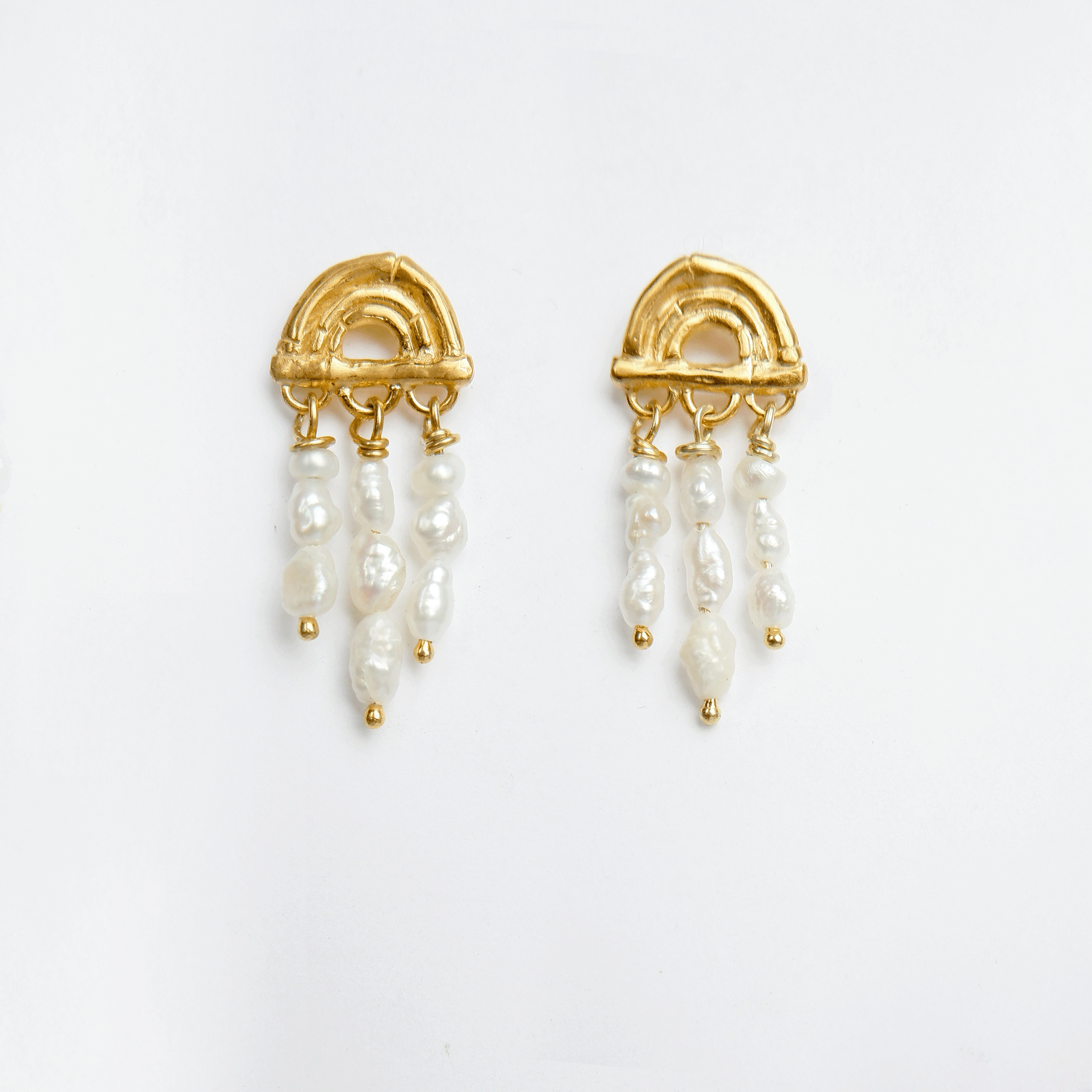 small stud earring in Gold Vermeil, featuring a triple arch of bamboo, hung with short strings of freshwater pearls. Shown in Sterling Silver and Gold Vermeil in an animated gif.