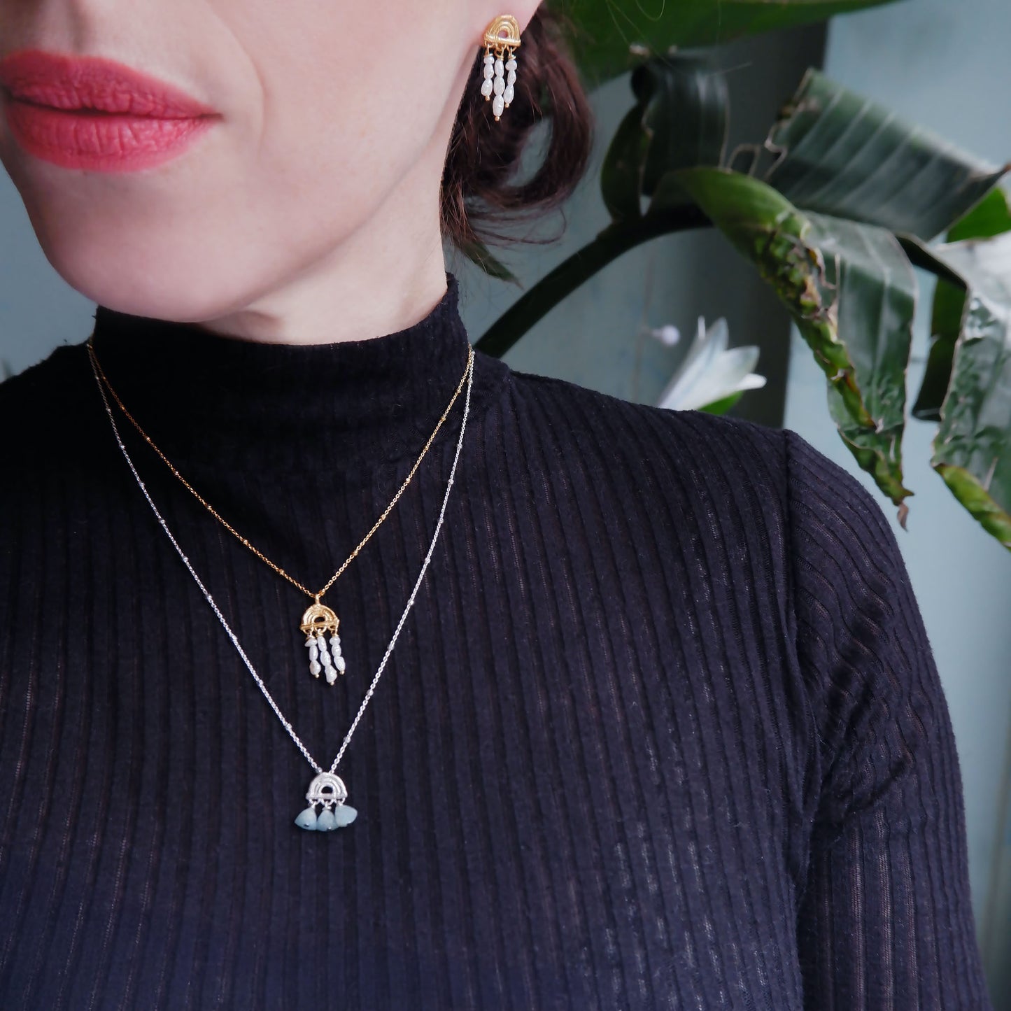 small stud earring in Gold Vermeil, featuring a triple arch of bamboo, hung with short strings of freshwater pearls and matching pendant necklace, worn together with another beaded mini bamboo sunrise pendant in sterling silver, on a longer satellite chain.