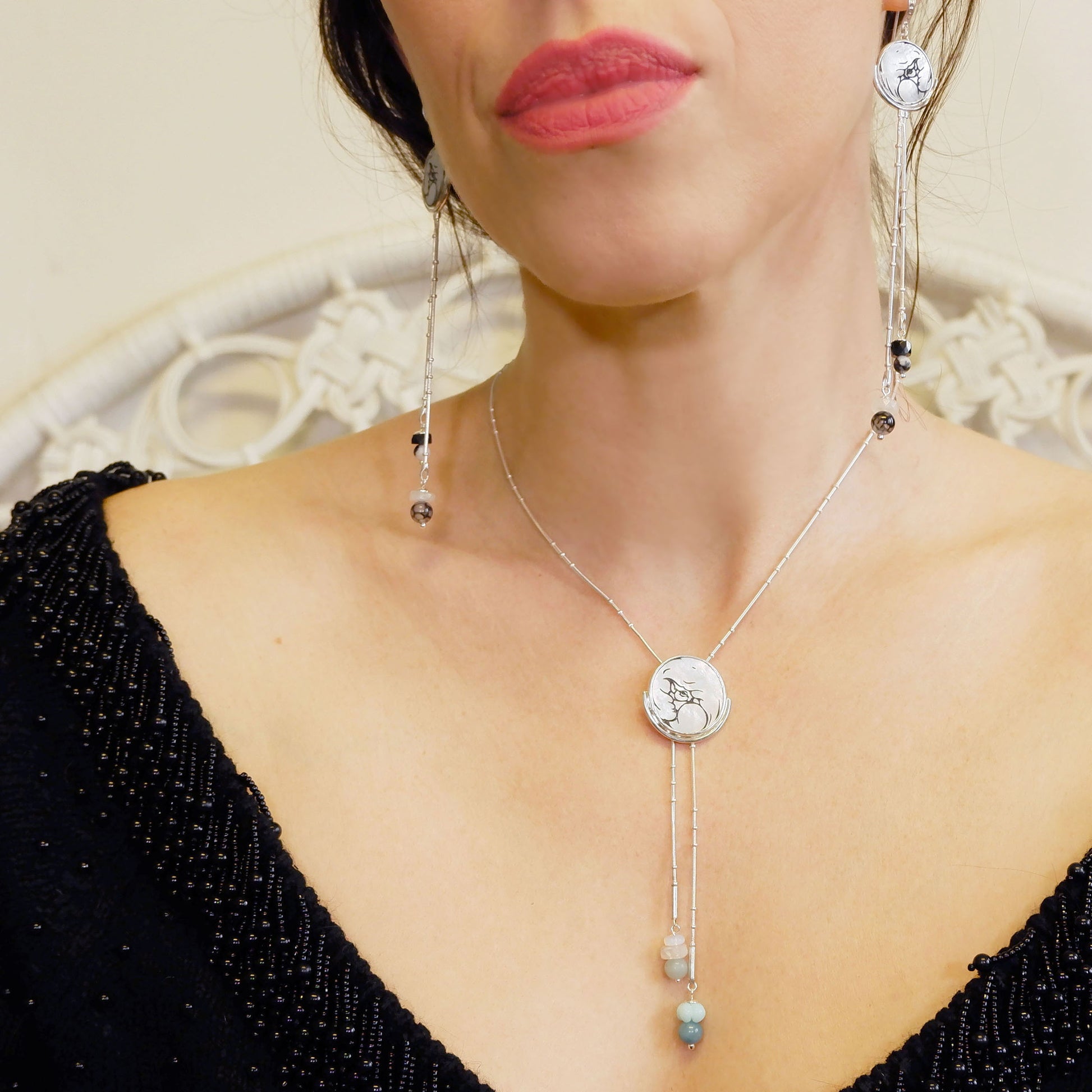 mother of pearl full moon earring, ehraved, with sterling silver beaded snake chain and gemstone bead tassels, on model