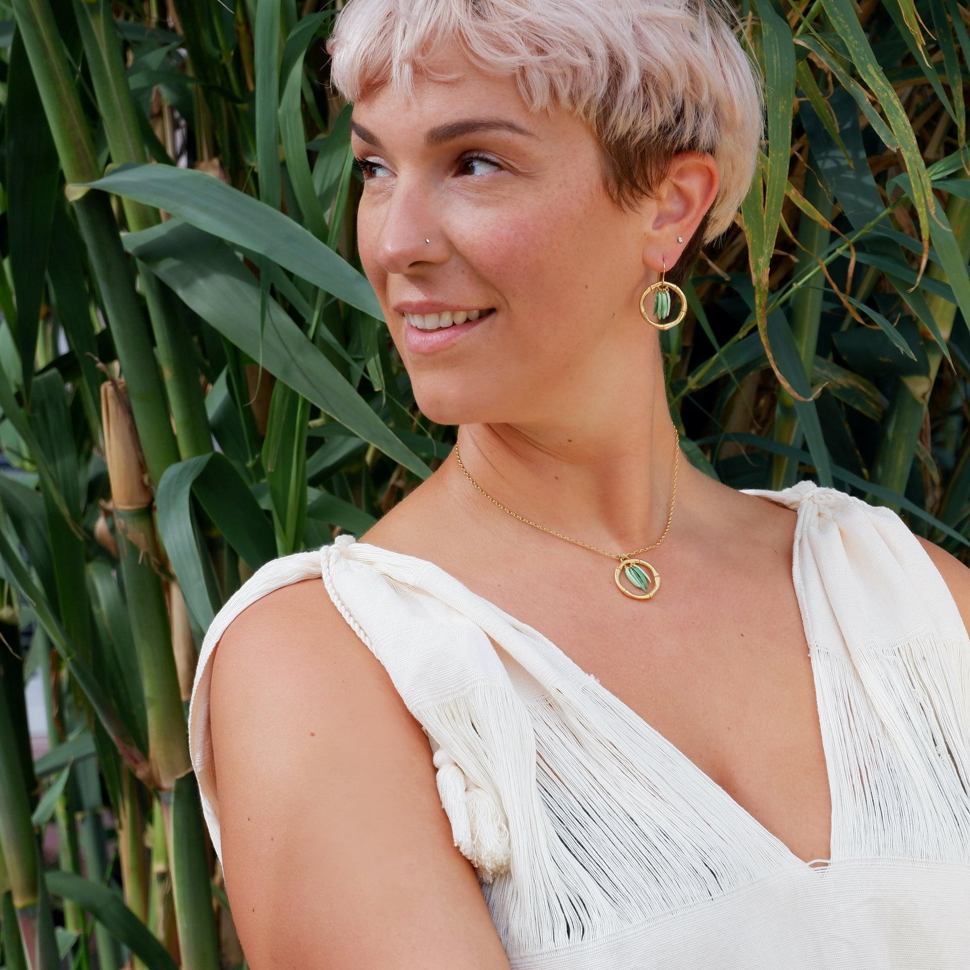 gold vermeil bamboo hoop earrings, green enamel leaves, model