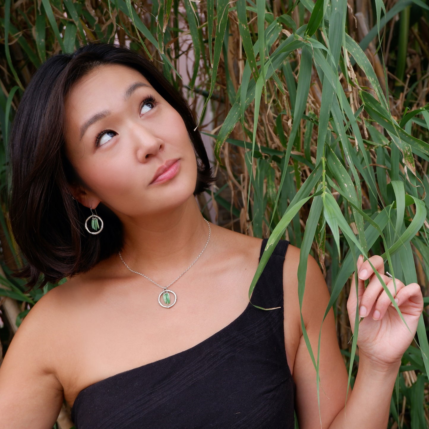 gold vermeil bamboo hoop earrings, green enamel leaves, model